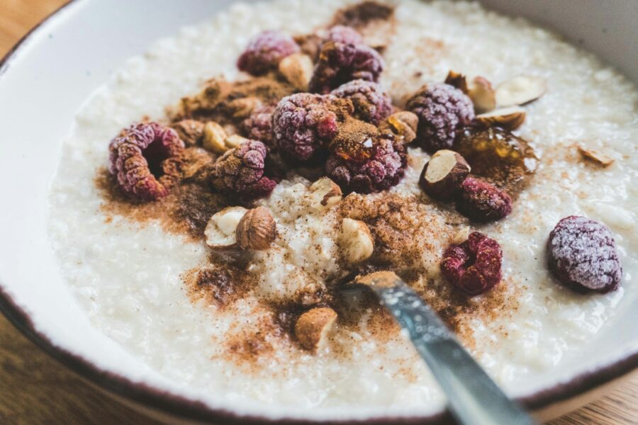 Bowl oatmeal berries nuts spoon