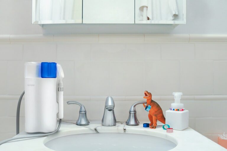 Child brushing teeth bathroom sink