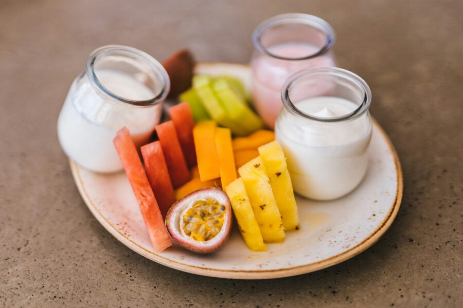 Healthy snack plate nuts fruit yogurt
