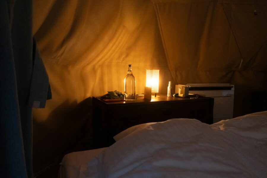 Bedside table notebook pen glass water