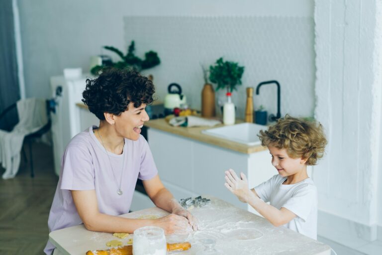 Parent talking two kids kitchen table