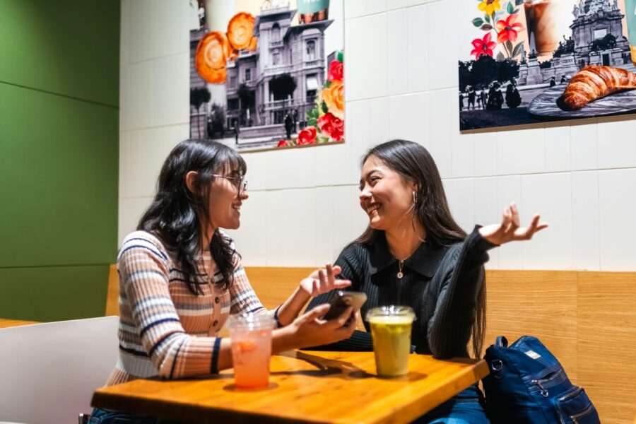 Two people talking cafe table