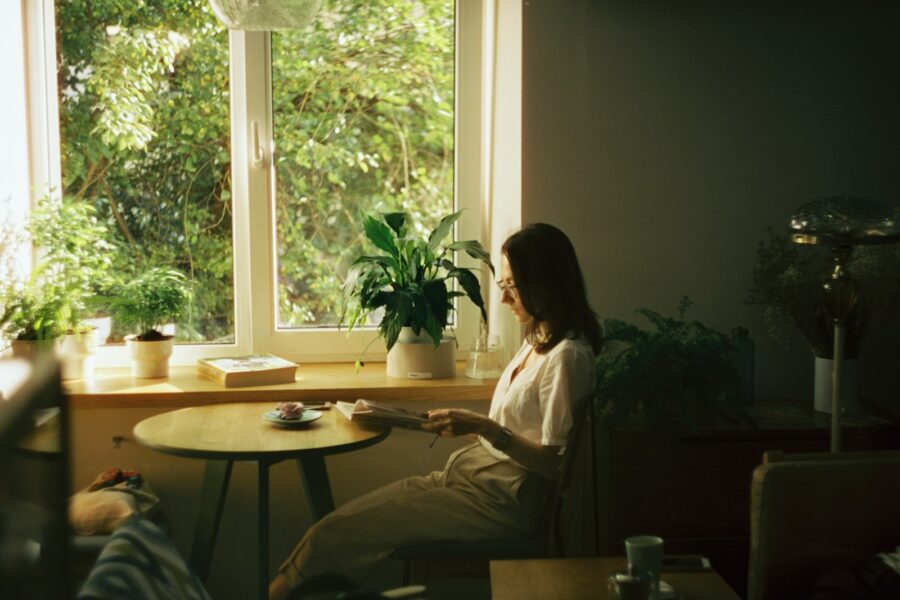Woman relaxing desk tea houseplant