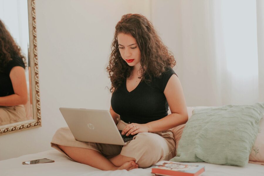 Woman home office knit loungewear laptop
