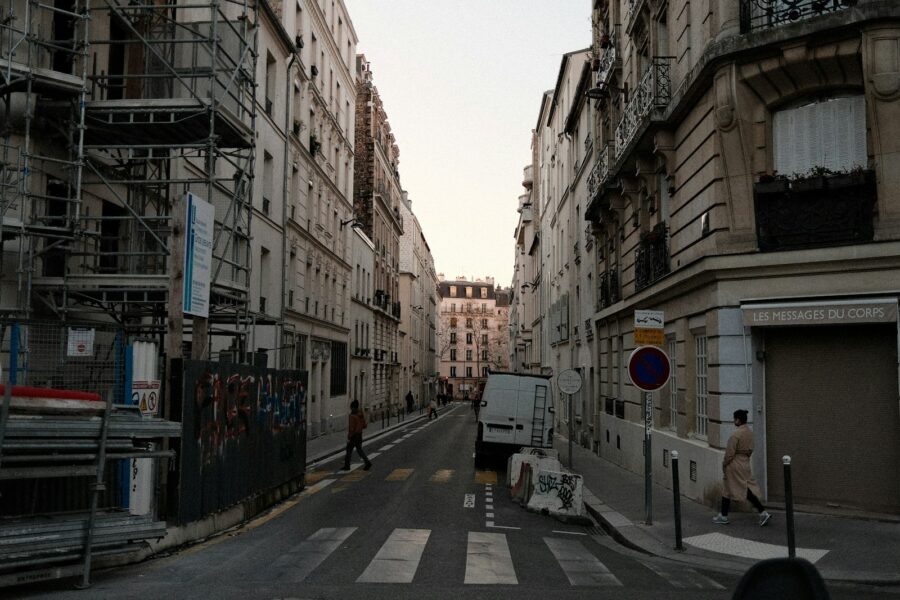 City street pedestrian crosswalk historic buildings