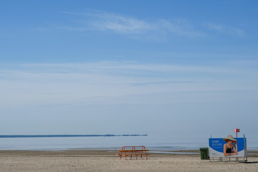 Empty sandy beach umbrella calm sea