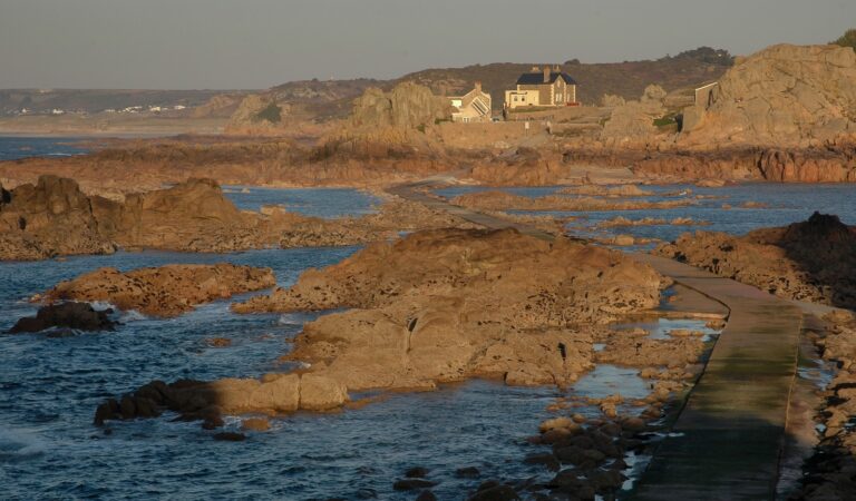 Quiet coastal promenade evening small beach cove rocks
