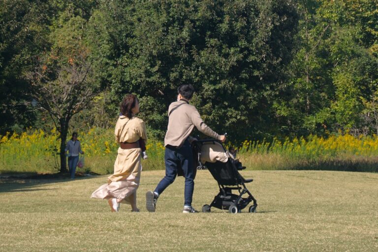 Friends walking park stroller