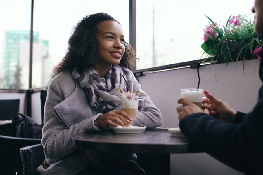 Two friends talking cafe