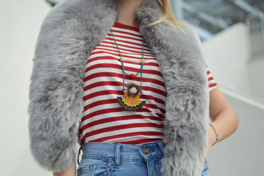 Woman jeans t-shirt layered necklaces street style