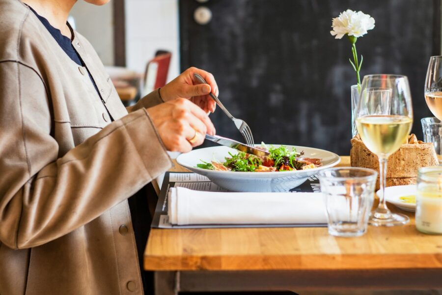 Person eating balanced meal slowly wooden table