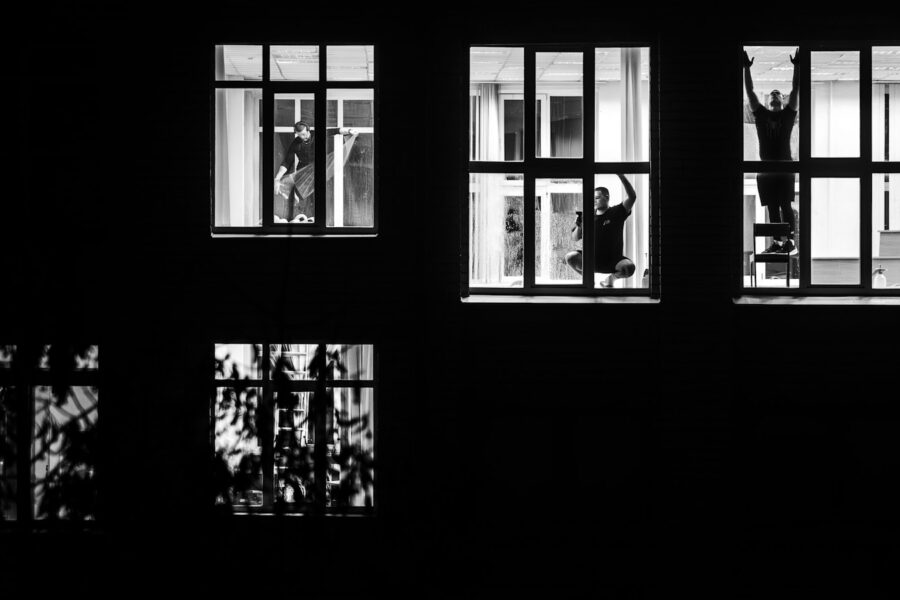 Office worker standing stretch window
