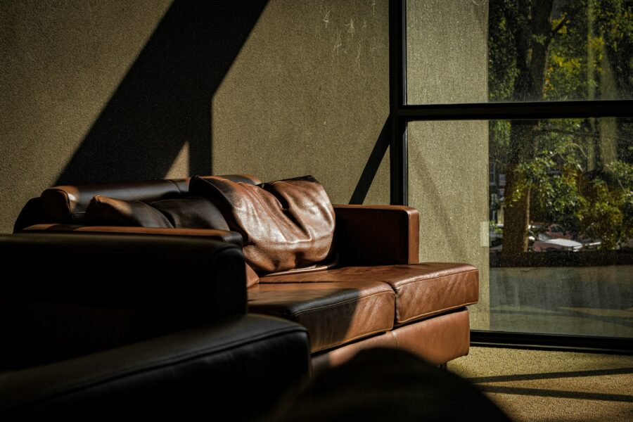 Modern hostel common room sofas backpack