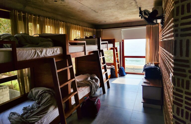 Hostel dorm bunk beds suitcase