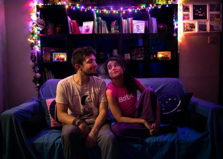 Couple talking sofa evening lamp light