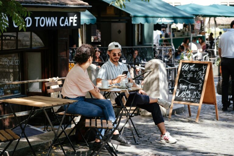 Cafe terrace locals tourists chatting