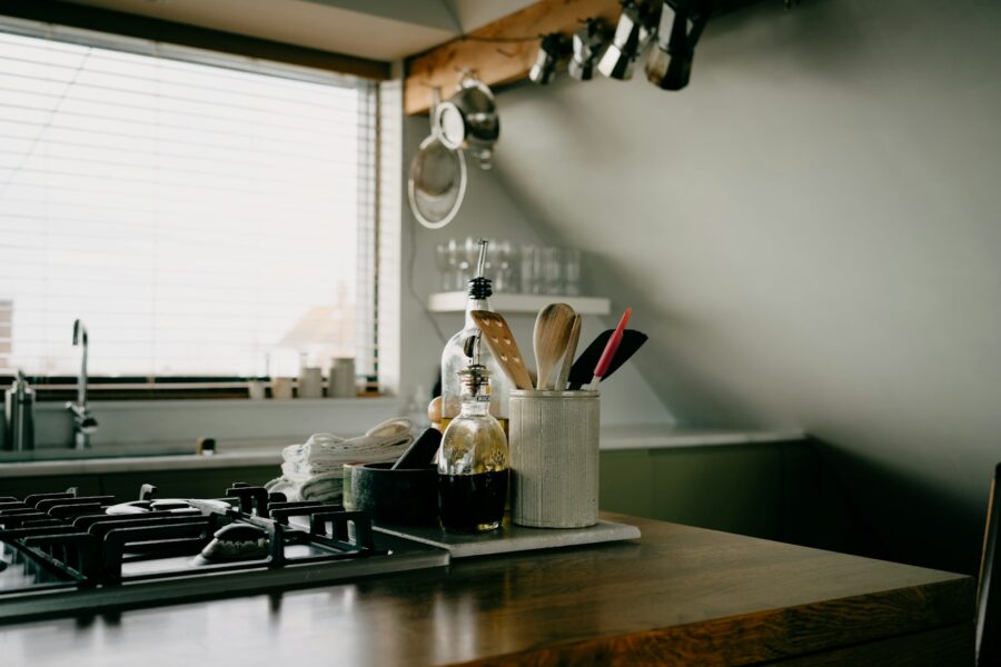 Organized kitchen countertop jars utensils