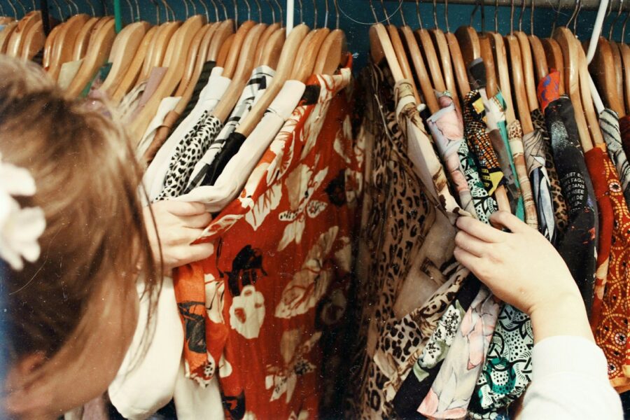 Person choosing clothes minimalist wardrobe