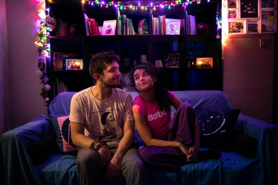 Tired couple sitting sofa evening living room