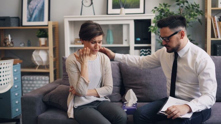 Woman comforting stressed partner home