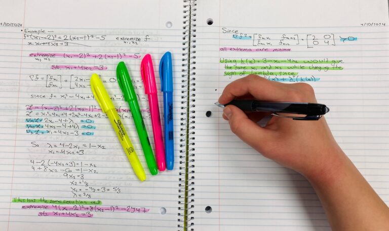 Person writing schedule colored highlighters