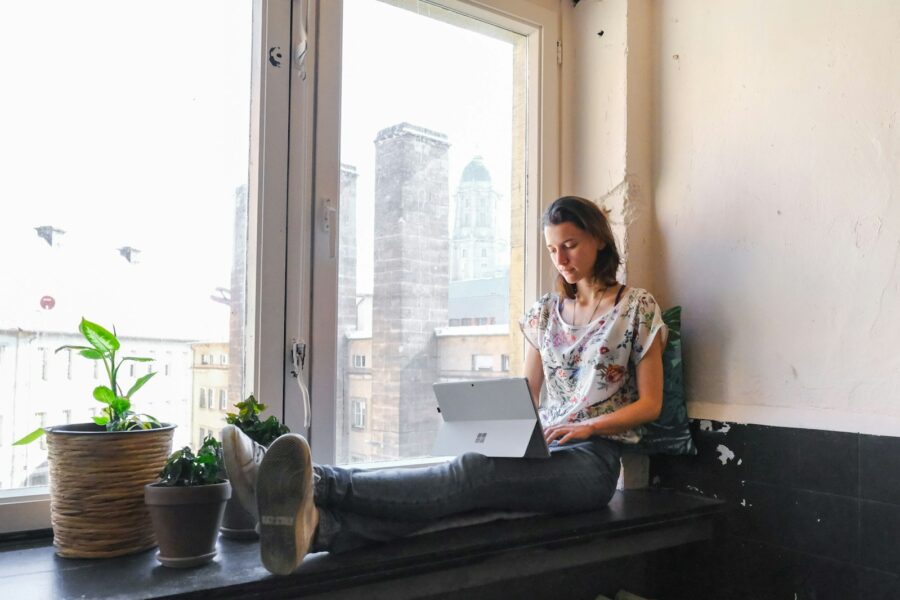Person taking short break office window