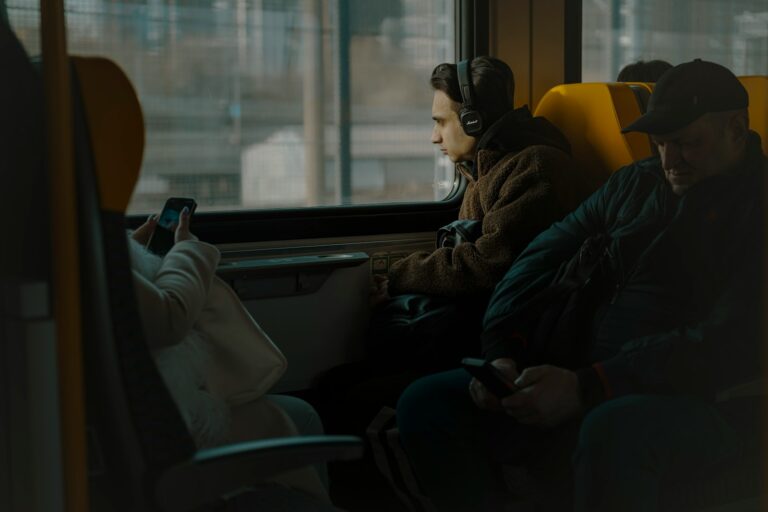 Bus interior passengers looking phones