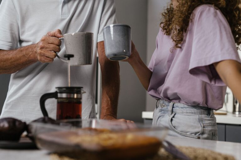 Couple kitchen morning light coffee mugs