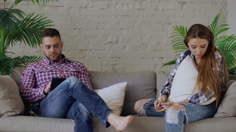 Parent child sitting sofa talking calmly