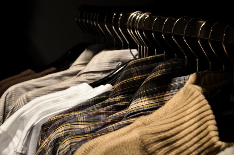 Neatly organized neutral capsule wardrobe rail
