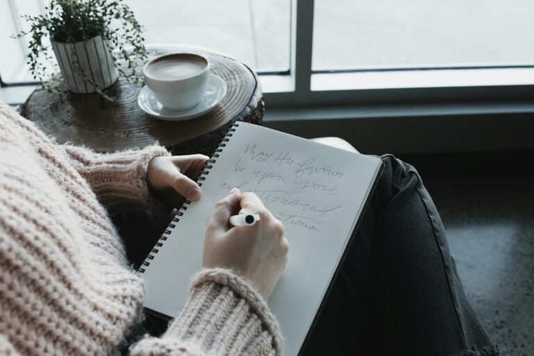 Person writing notebook