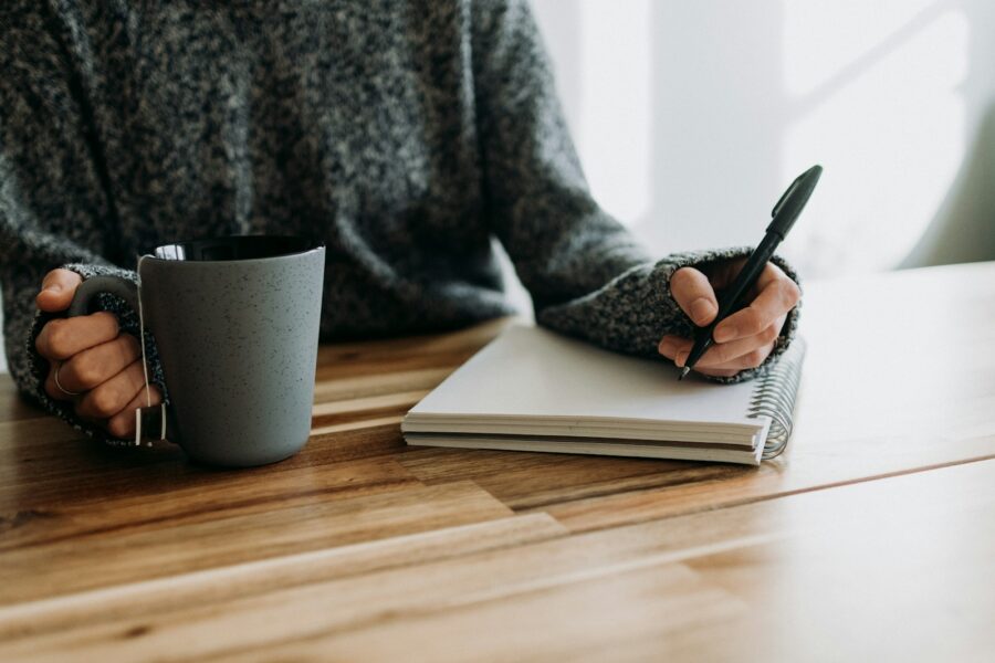 Person writing notebook