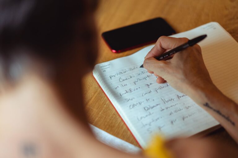 Thoughtful person writing