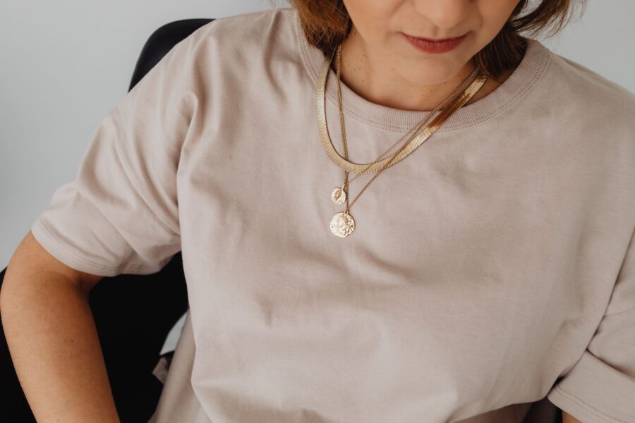 Woman layered necklaces