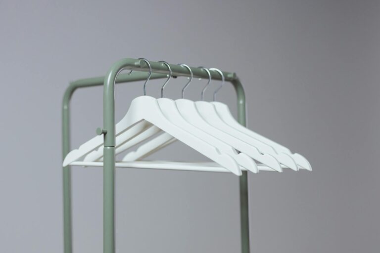 Wardrobe rack neutral clothes wooden hangers