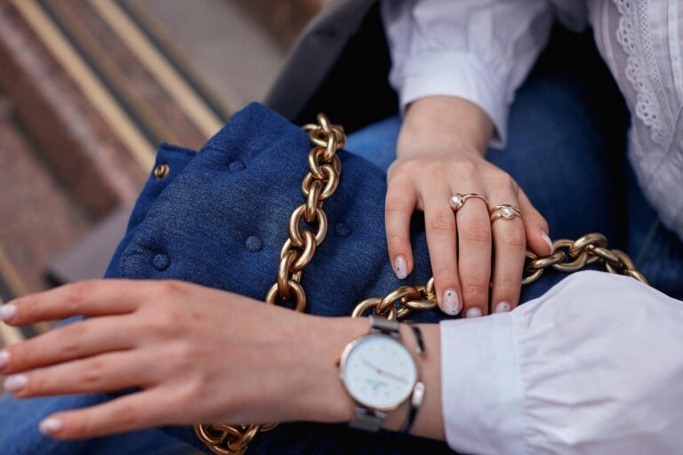 Close accessories belt handbag jewelry woman choosing clothes