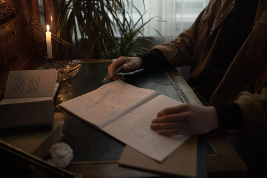 Person writing notebook