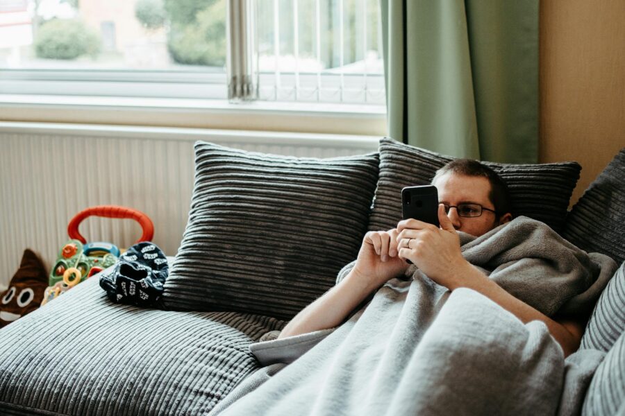 Person relaxing sofa