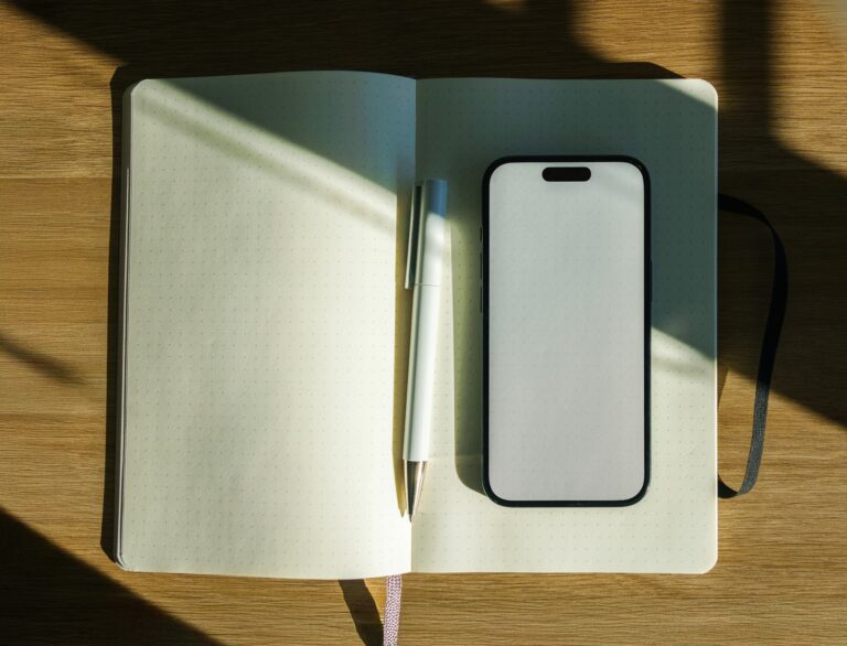 Notebook pen coffee mug wooden desk