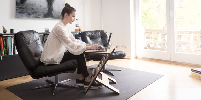 Woman doing chair squats home office person marching