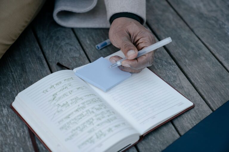 Person writing to-do