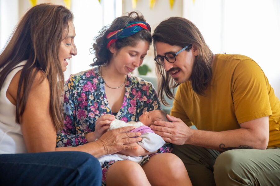 Friends visiting newborn