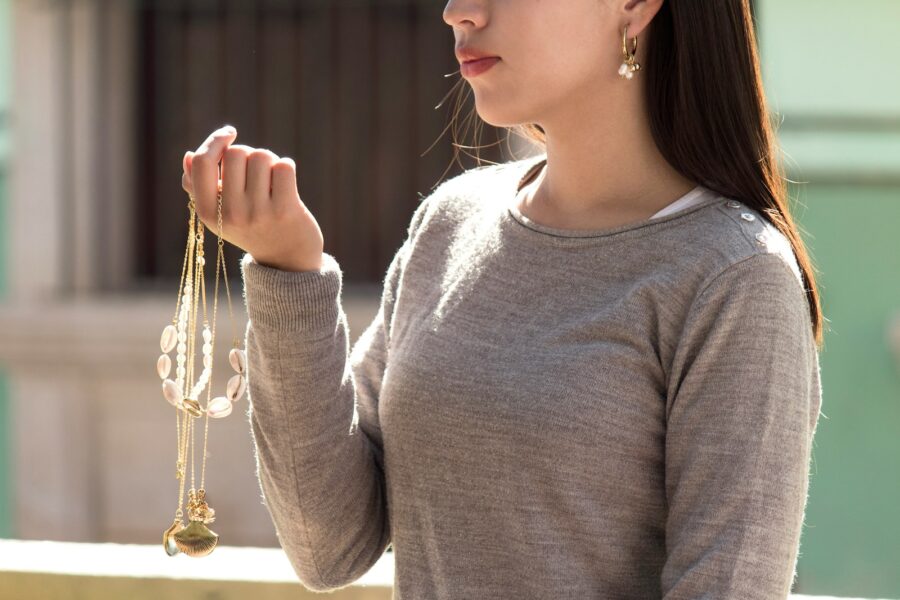 Woman layered necklaces