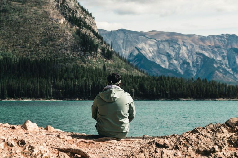 Hiker sitting lake