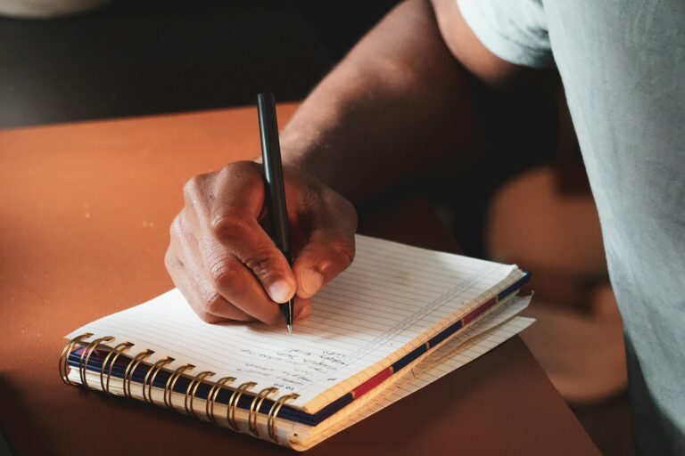 Person journaling table