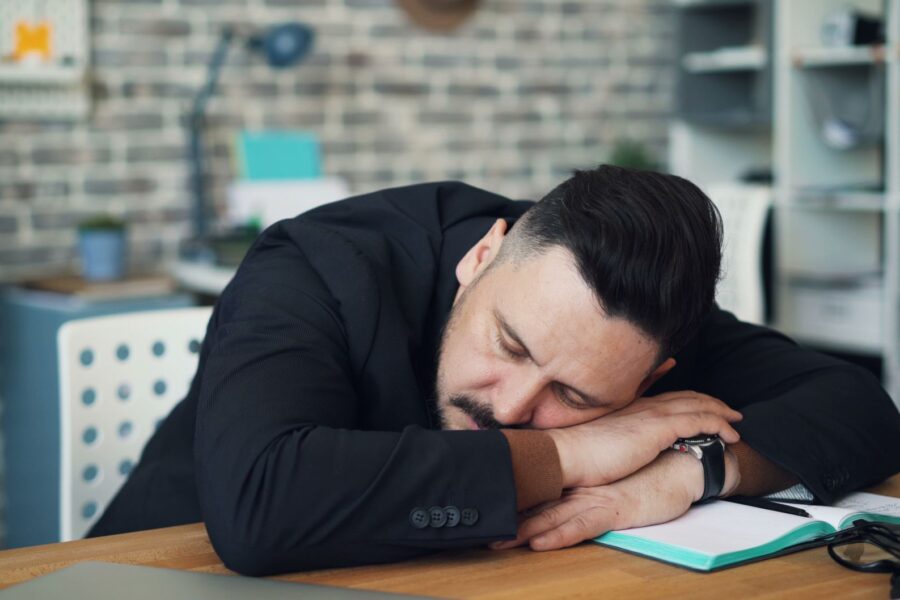 Tired person desk