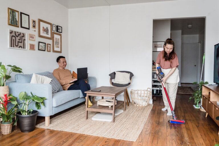 Teenager vacuuming living