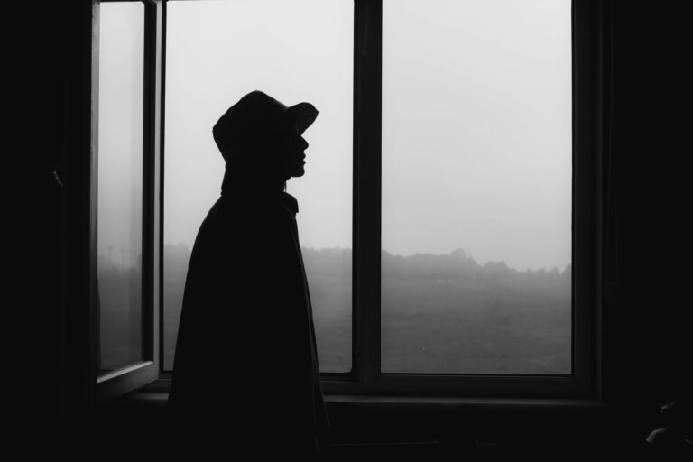 Person standing window