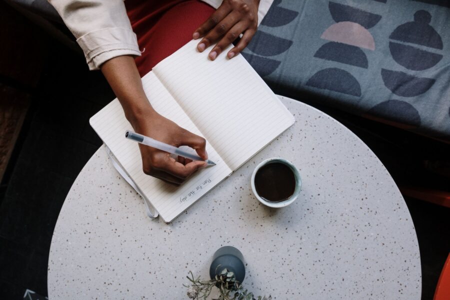 Person writing planner