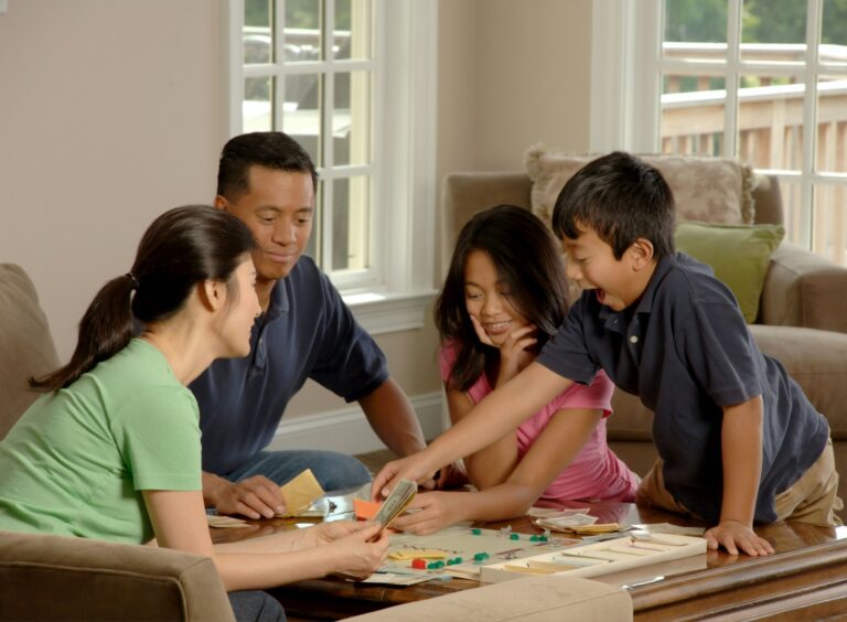 Siblings playing board